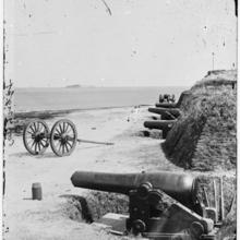 A gun battery at Fort Johnson, South Carolina, in 1865. Fort Sumter can be seen on an island in the background.