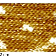 Electrochemical scanning tunneling microscopy of sulfonate terminated disulfide molecules on the chloride covered Cu (100) surface that models the active surface phase associated with superconformal Cu deposition.