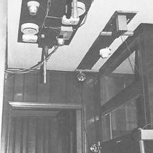 black and white image of smoke detectors on a ceiling