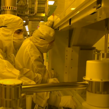 Photo of workforce in clean suits in the manufacturing fab center in New York