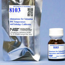 The outer packaging of RM 8103 is beside a bottle of RM 8103.