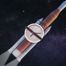 Illustration shows an analog clock strapped to a rocket heading into space. 