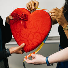 Use multiple measurement methods to determine the perimeter of the heart candy box.