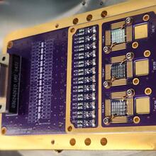 Thermometer chips is one of several square chips integrated into a rectangular holder with a circuit board.
