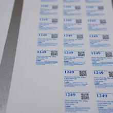 A sheet of square NIST labels saying "Standard Reference Material 1249."