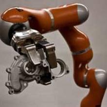 The NIST Dexterous Manipulation Testbed features a seven degree-of-freedom highly dexterous robot and a seven degree-of-freedom, three fingered robotic hand.