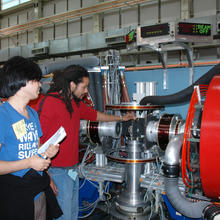3 students around a spin echo spectrometer