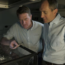 NIST physicists Scott Diddams (left) and Scott Papp