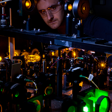 Researcher Kevin Wright checks part of the experimental apparatus.