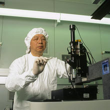 Researcher Stephen Hsu prepares to measure nanoscale friction between a diamond tip and a silicon surface in a NIST Advanced Measurement Laboratory sophisticated low-vibration "clean rooms."