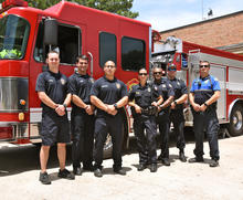 Emergency Services employees from the City of Germantown, TN standing in front of the fire truck at the station.