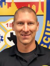 An image of Patrick Hagan with a fire rescue logo in the background.