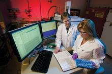 Two female scientists working in a laboratory.