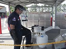 Photo of a NC Inspector at an LPG Direct Sale Refilling Station