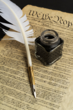 Photo of U.S. Constitution with quill pen and ink jar