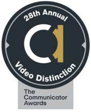 Black circle. White and gold lowercase A in the middle. Words around edge read: 28th Annual Video Distinction. Silver box below saying The Communicator Awards