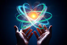 Image of atom being held in hands