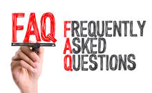 Hand holding red letters FAQ, Frequently Asked Questions