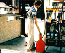 Tina Butcher checking a gas pump circa 1980s
