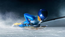 person in blue winter wear on bobsled