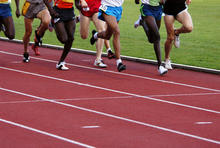 generic image of lower bodies of runners on a track field