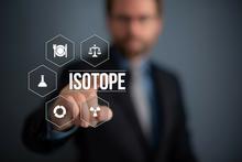 Figure with the word “isotope” and related icons superimposed on a photograph of a man pointing to the figure. 
