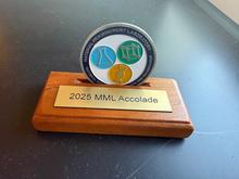 Challenge coin on a wooden base