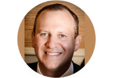 Headshot of Brent Holden, a man with short brown hair, smiling.