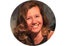 Headshot of Katerina Megas, a woman with long brown wavy hair, wearing a black tank top, smiling.