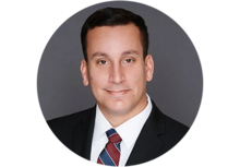 Professional headshot of Felipe Fernandez, a man with short hair, smiling, wearing a suit and tie.