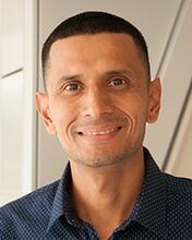 Jay Torres smiling for a headshot. 