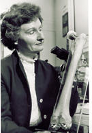 researcher holding artificial joint researcher holding artificial joint