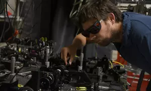 NIST physicist Krister Shalm with the photon source used in the Bell test