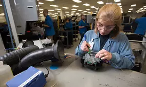 A woman working at Itron
