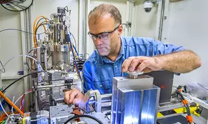 Picture of the sample area of the NIST X-ray Adsorbtion Fine Structure instrument, with NIST scientist Bruce Ravel, located at the National Synchrotron Light Source.
