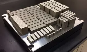 Additively-manufactured specimens for mechanical testing. Specimens have varying build directions to measure possible anisotropy of properties we own this image.