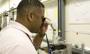Daniel Sawyer makes a measurement using the interferometer.