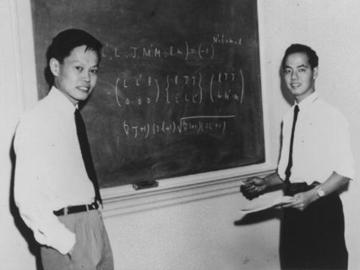 Yang and Lee in front of a chalkboard at the Institute for Advanced Study in Princeton, N.J.