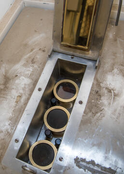 Photo of 3 Curie radium standards inside their copper canisters
