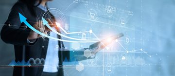 Business woman using tablet analyzing sales data and drawing growth graph with icon customer network connection on virtual interface
