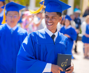 The Charter School of San Diego photo showing a male student graduating.
