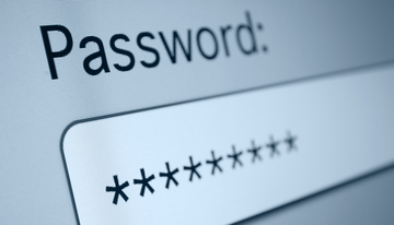 A computer screen shows a password field box with characters hidden by asterisks.