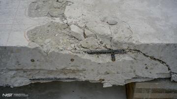 Photo of cracked white concrete slab