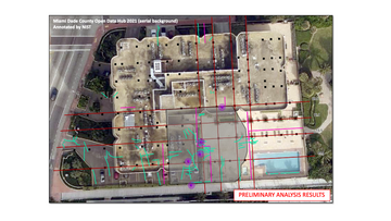 Aerial view of Champlain Towers South before the partial collapse is marked with a red grid and smaller green lines clustered on one side of the building. 