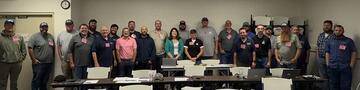 class photo of students in the Vehicle and Axle-load Scale training