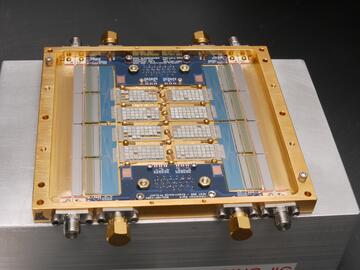 An array of sensors appear as a set of rectangles within a gold-colored metal frame.