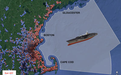 Tan and red aircraft carrier in grey colored segment of ocean off Cape Cod, MA, represents ship at sea while red and blue balloons along the coast indicate wireless users.