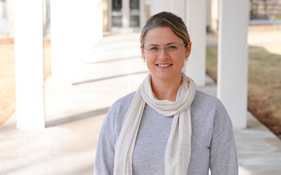 Justyna Zwolak poses for a casual photo outdoors on the NIST campus.