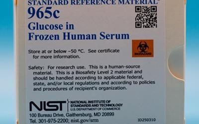 picture of a white box with a sticker label with a sticker label containing words Standard Reference Material 965c Glucose in Frozen Human Serum