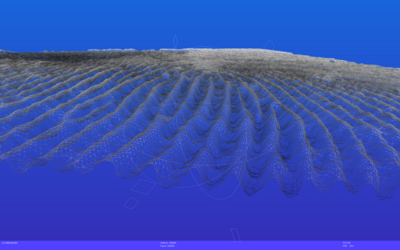 A digital artwork featuring a wavy, net-like structure against a gradient blue background. The structure creates an undulating pattern, resembling a mesh or wave, with variations in shading adding depth. Small geometric shapes are faintly visible within the design.